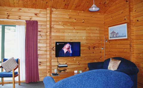 Two Bedroom Chalet (Sleeps 6) | Living area | 40-inch LED TV with satellite channels, TV, DVD player