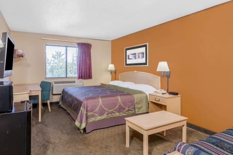 Suite, 1 King Bed, Microwave | Desk, laptop workspace, blackout drapes, iron/ironing board