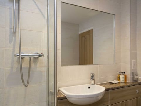 The Linhay Shower/bathroom with underfloor heating & Shower over bath.