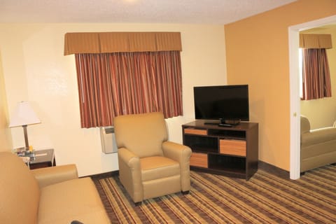 1-Bedroom Suite,1 King Bed and 1 Queen Sofa Bed, Non-Smoking | Living area | 40-inch TV with cable channels