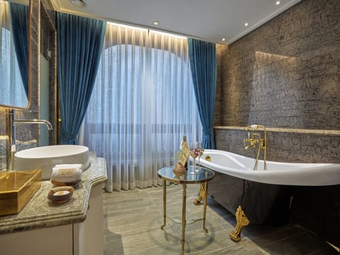 Chic Deluxe Room | Bathroom | Separate tub and shower, deep soaking tub, rainfall showerhead