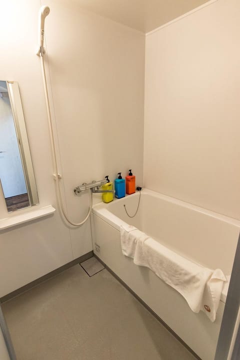 Quadruple Room, Bathtub (Q) | Bathroom | Separate tub and shower, free toiletries, hair dryer, slippers