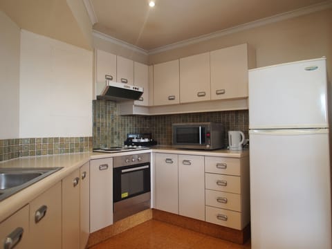 Standard One Bedroom Apartment | Private kitchen | Fridge, microwave, stovetop, dishwasher