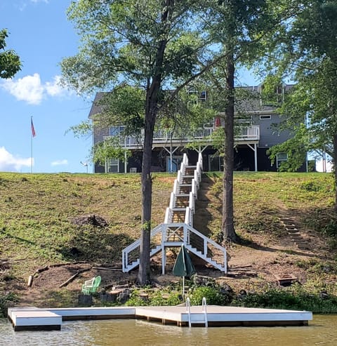Water View of House with Dock and Stairs.
