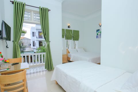 Standard Triple Room, City View | Minibar, individually decorated, individually furnished, desk