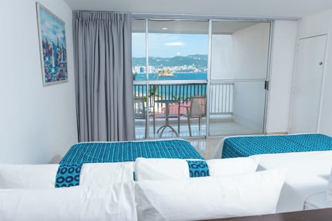 Studio Suite, 2 Double Beds, Partial Sea View | In-room safe, desk, laptop workspace, blackout drapes