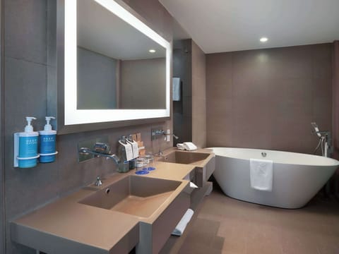 Executive Suite, 1 King Bed | Bathroom | Shower, eco-friendly toiletries, hair dryer, bathrobes