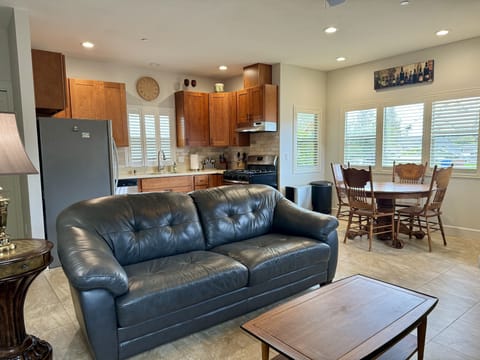 Open living room /kitchen. Tile flooring throughout. Shutters adjustable.