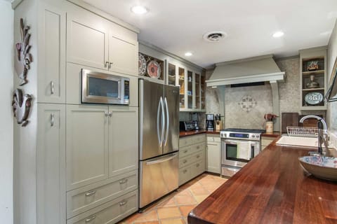 Not only is the full kitchen convenient for whatever you've got cooking, but it's decor announces that family belongs here!