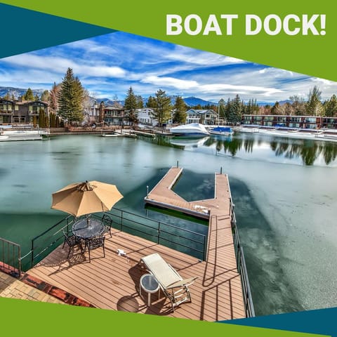A tranquil marina setting with snow-capped mountains providing a stunning backdrop to the area's year-round recreational opportunities.