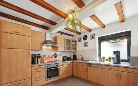 Fully equipped, spacious kitchen with oven and dishwasher