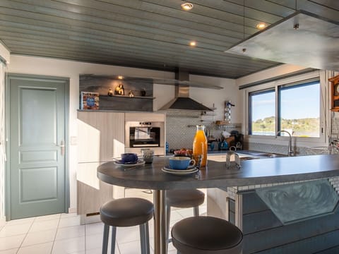 Furniture, Property, Table, Countertop, Cabinetry, Wood, Interior Design, Door, Kitchen, Stool