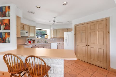 Breakfast bar seating around the kitchen