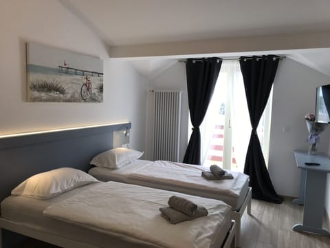 Deluxe Double or twin Room, 2 Twin Beds, Sea View | Individually decorated, individually furnished, free WiFi, bed sheets