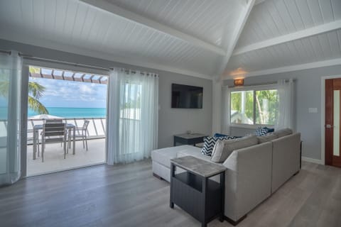 Suite, Ocean View | Living area | 40-inch flat-screen TV with cable channels, TV