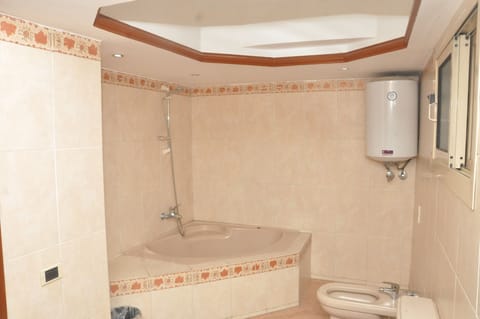 Junior Suite, Nile View | Bathroom | Shower, hair dryer, slippers, heated floors