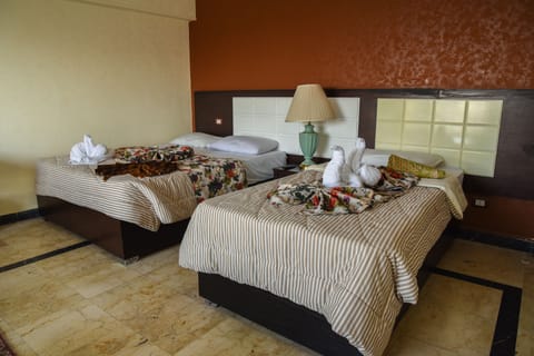 Deluxe Room, River View | Minibar, individually decorated, individually furnished, soundproofing