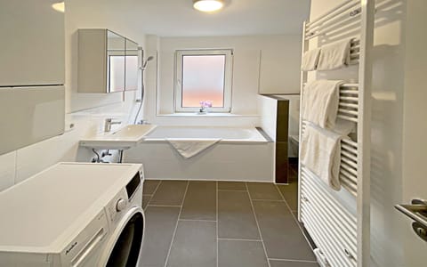 Separate tub and shower, rainfall showerhead, hair dryer, towels