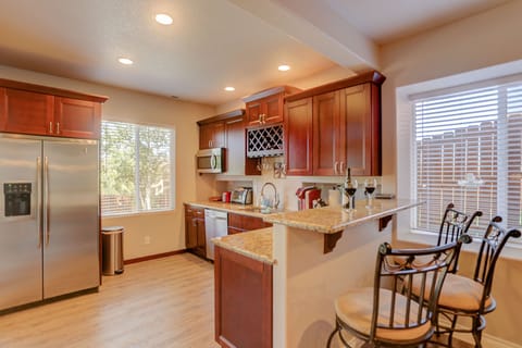 Kitchen with Breakfast Bar, Granite Counter and Stainless Steel Appliances