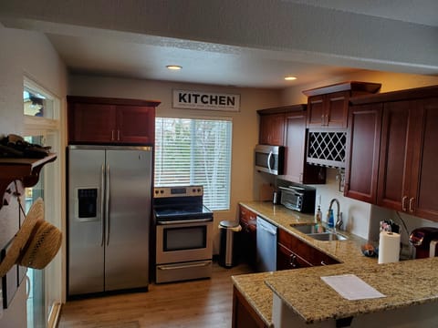 Full Kitchen with Stainless Steel Appliances, Granite Counter Tops, Tall Cabinet