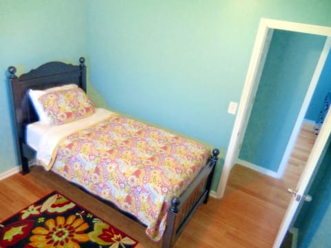 Queen bed in bedroom 1, twin bed in bedroom 2, and sofa sleeper in living room