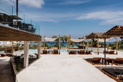 Seasonal outdoor pool, open 9:30 AM to 6:00 PM, pool umbrellas