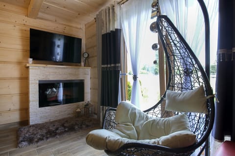 Deluxe Chalet, 3 Bedrooms | Living area | LED TV, toys