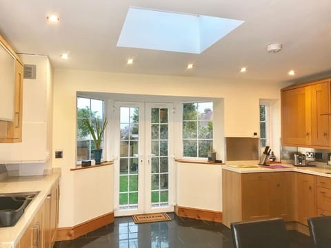 Fully fitted kitchen with garden view