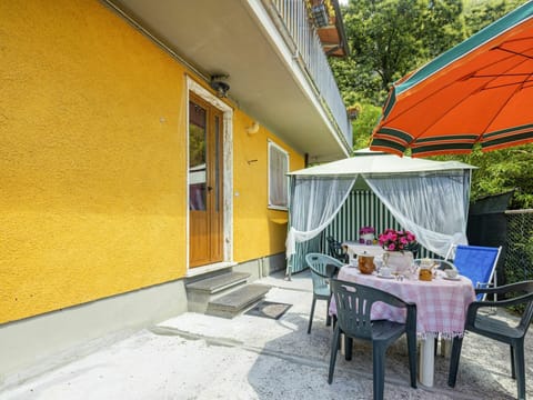 Plant, Table, Shade, Building, Tree, Yellow, Outdoor Furniture, House, Flowerpot, Leisure
