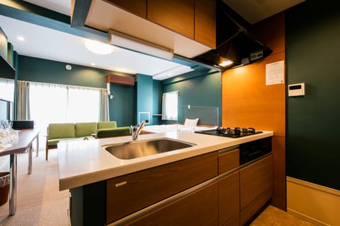 Family Suite | Private kitchen | Fridge, microwave, stovetop, electric kettle