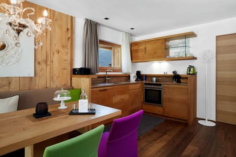 Deluxe Suite, 2 Bedrooms, Balcony, View | Private kitchen | Fridge, stovetop, electric kettle, highchair