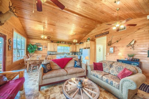 The living room has a sofa, a love seat with ottoman and a futon sleeps 2.