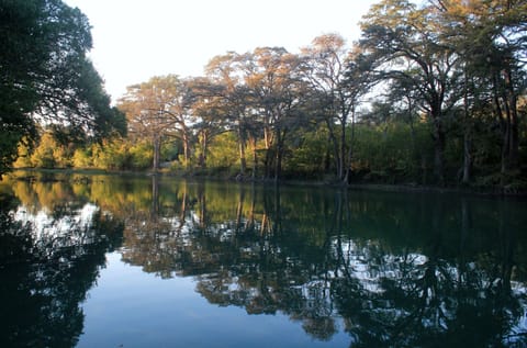 View From River Dock At Sunset