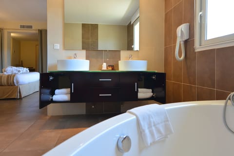 Suite, 2 Bedrooms | Bathroom | Free toiletries, hair dryer, towels