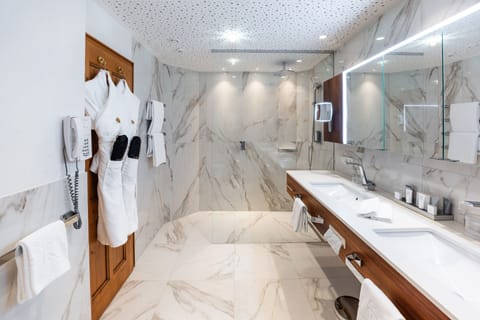 Designer toiletries, hair dryer, bathrobes, slippers