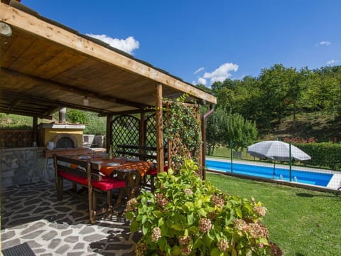 Sky, Cloud, Plant, Building, Flower, Shade, Cottage, Flowerpot, Outdoor Furniture, Chair