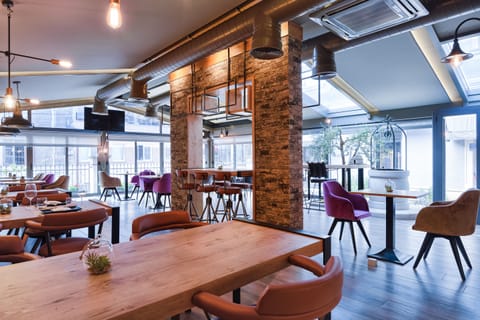 Lunch, dinner served; local and international cuisine, garden views 