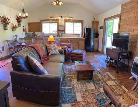 Living area with Roku TV and a second queen bed. 