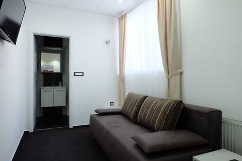 Family Double Room | Living area | Flat-screen TV