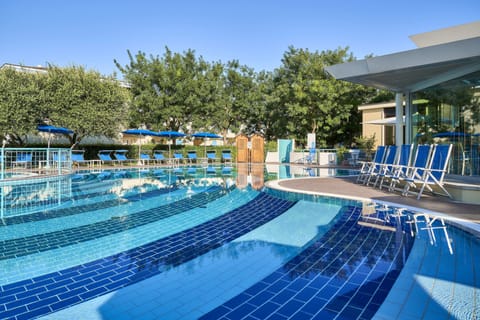 Seasonal outdoor pool, open 9:00 AM to 6:00 PM, pool umbrellas