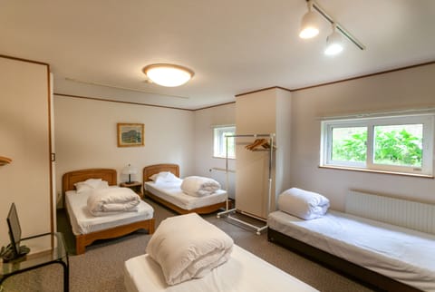 Standard Quadruple Room, Shared Bathroom (with Futon) | Free WiFi, bed sheets