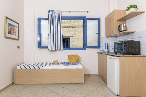 One Bedroom Apartment with Pool View | Private kitchenette | Mini-fridge, oven, stovetop, electric kettle