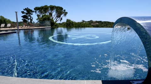 Outdoor pool, a heated pool, pool umbrellas, sun loungers