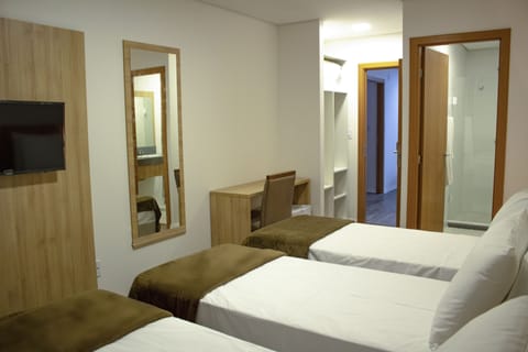 Deluxe Triple Room | Minibar, desk, laptop workspace, free WiFi