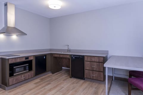 Suite, 1 King Bed, Accessible, Non Smoking | Private kitchen | Mini-fridge, microwave, coffee/tea maker, cookware/dishes/utensils