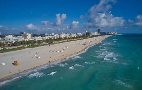 Beach nearby, white sand, beach towels