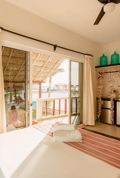 Beach Front View | Minibar, in-room safe, individually decorated, individually furnished