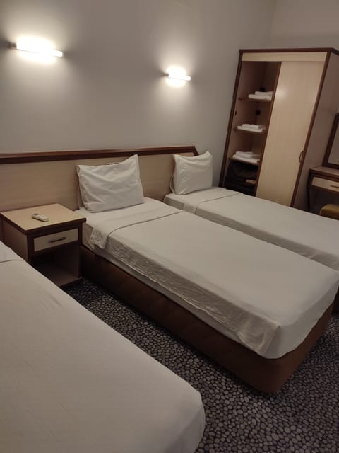 Basic Triple Room | Minibar, soundproofing, free cribs/infant beds, free WiFi