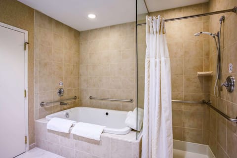 Suite, 1 King Bed, Accessible | Bathroom | Combined shower/tub, designer toiletries, hair dryer, towels