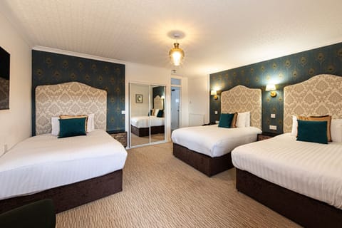 Triple Room | Desk, blackout drapes, iron/ironing board, free WiFi